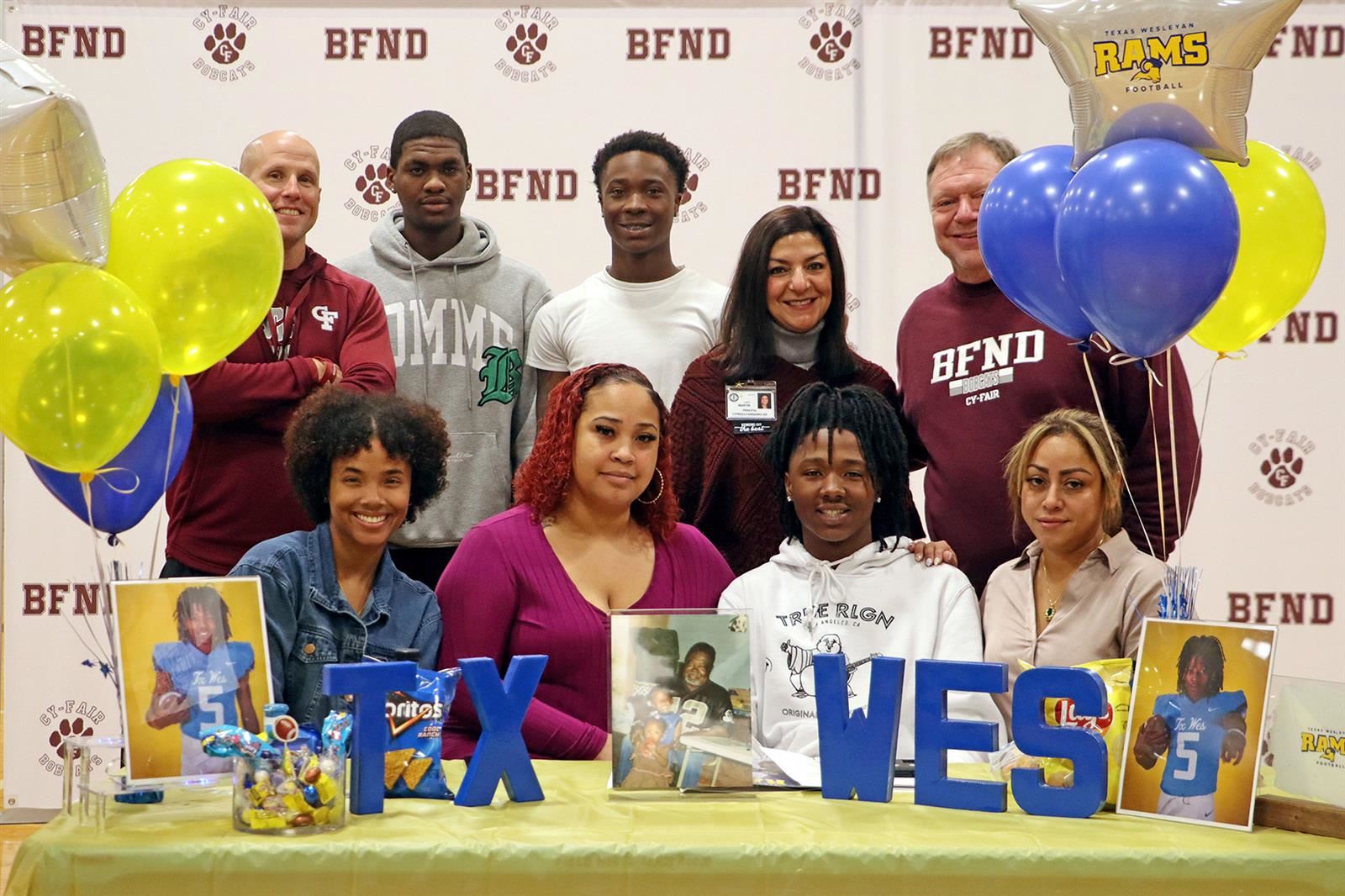 Cy-Fair High School senior Shawn Atkins, seated second from right, signed a letter of intent.